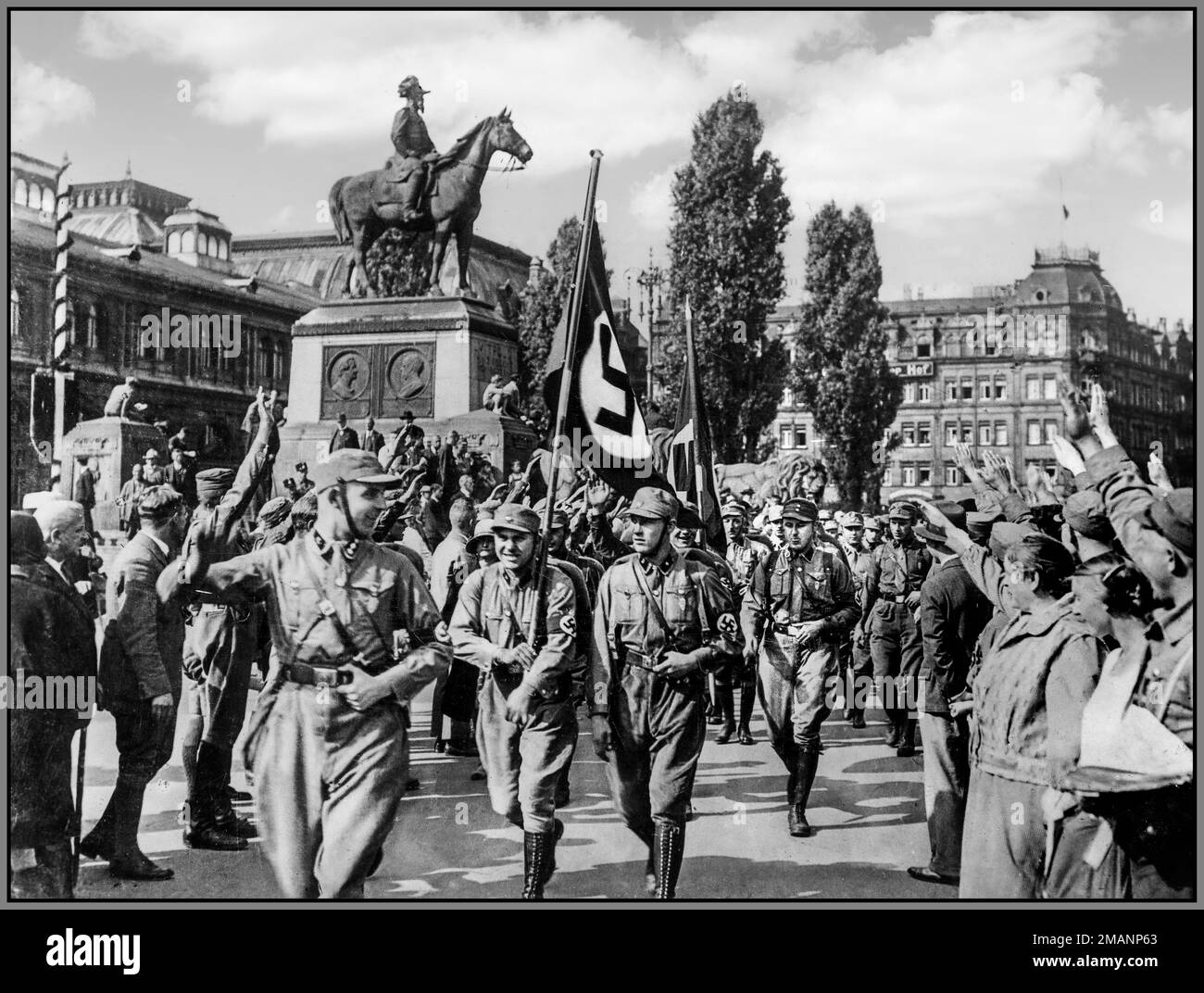 NSDAP; Reichsparteitag; Nürnberg, August 1929 Horst Wessel in his Sturmführer uniform leading an Sturmabteilung (SA) unit at a Nazi Party rally in Nuremberg, Germany, in August 1929; in front of the main railway station (Hauptbahnhof) Horst Wessel (1907 – 1930) was a German Nazi activist who was made a posthumous hero of the Nazi movement following his violent death in 1930 Nazi Germany Stock Photo