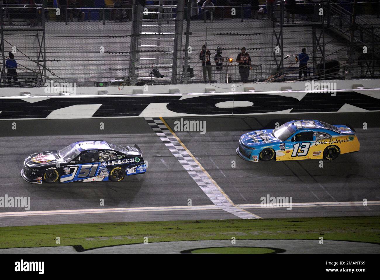 Jeremy Clements (51) crosses the finish line in front of Timmy Hill (13 ...