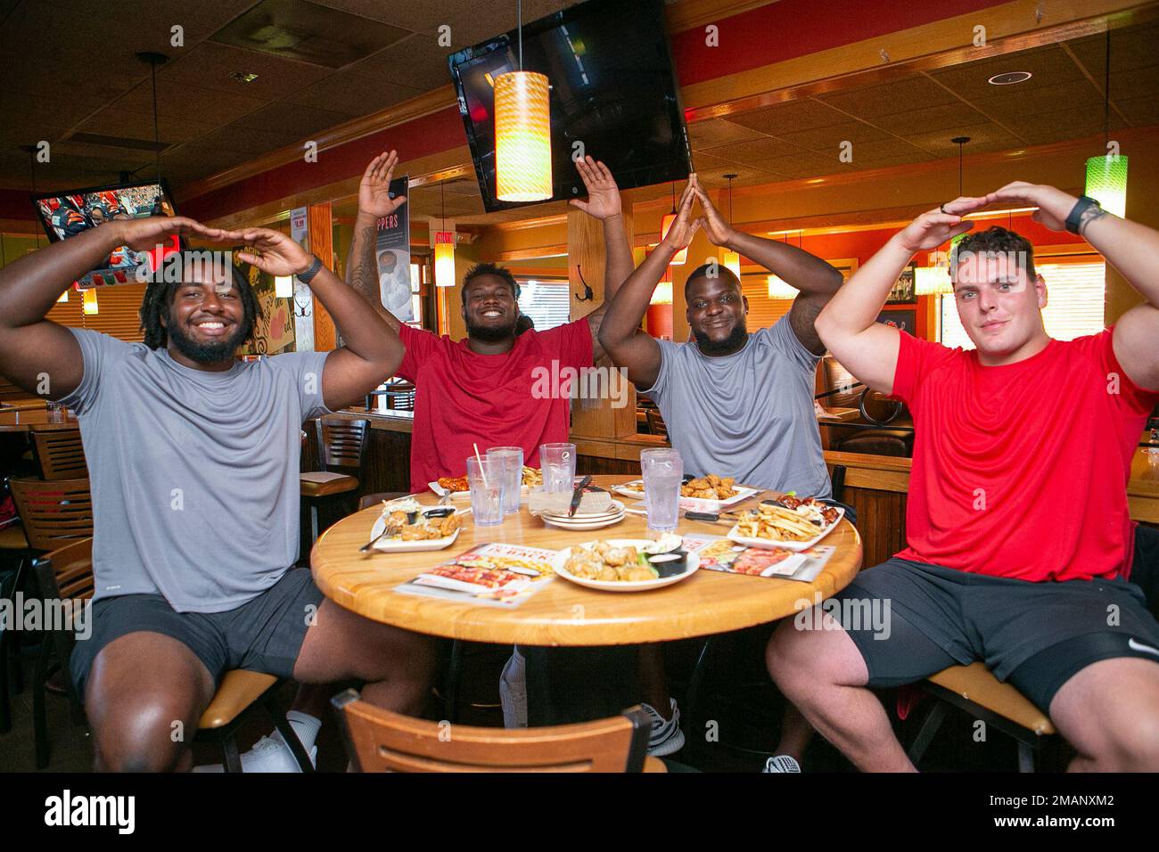 IMAGE DISTRIBUTED FOR APPLEBEE'S College football players, from left