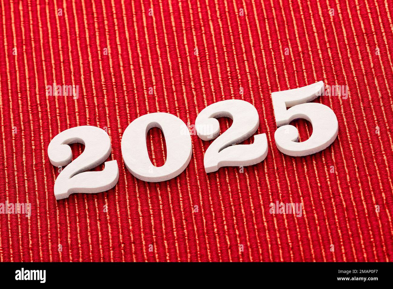 Happy new year 2025 in white letters on red background Stock Photo Alamy