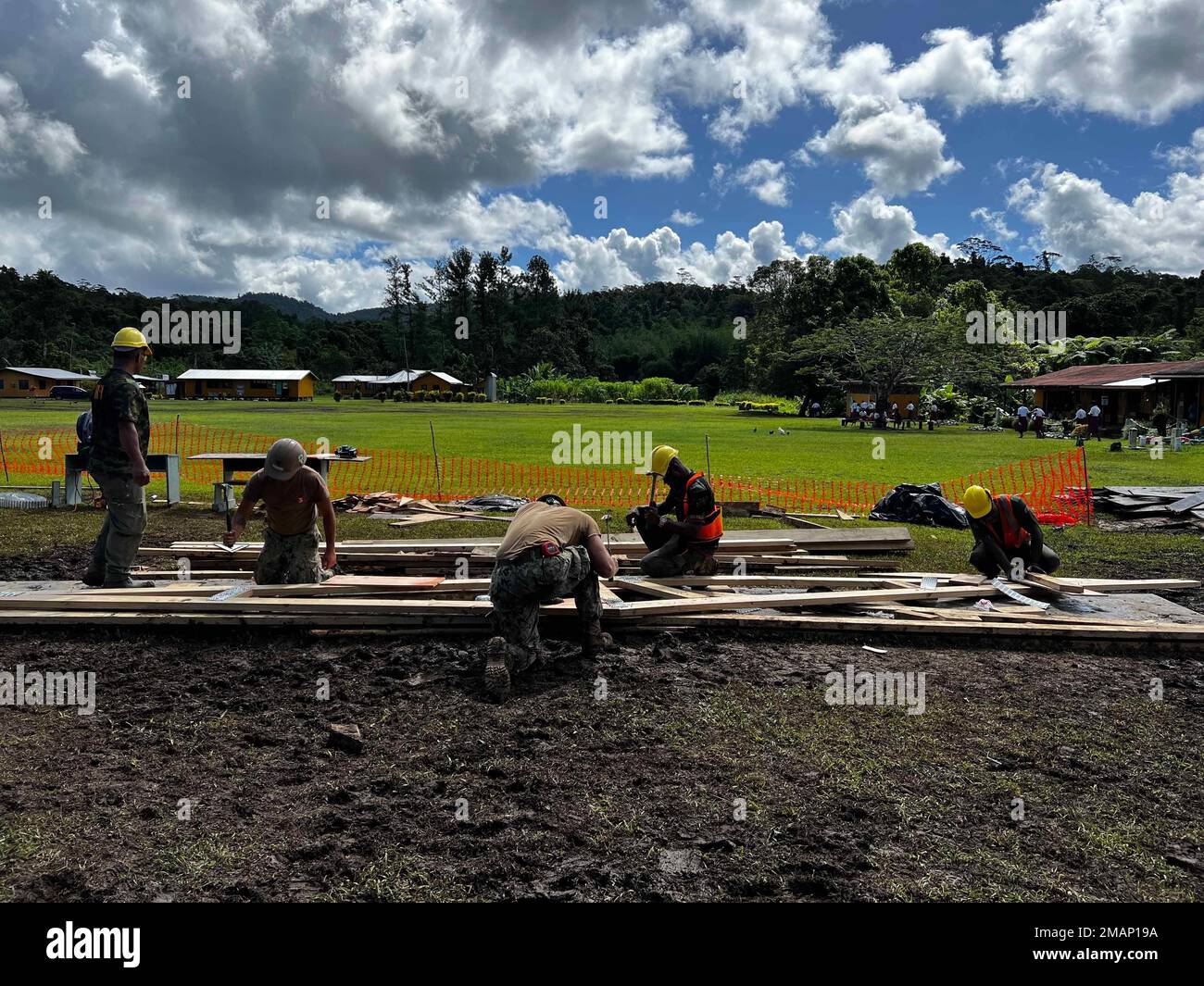 SAVUSAVU, Republic of Fiji (June 14, 2022) — U.S. Navy Seabees assigned to Naval Mobile Construction Battalion 3 NMCB-3), alongside the Republic of Fiji Military Forces, construct roof trusses in support of a Pacific Partnership 2022 engineering project in Savusavu, Fiji. Now in its 17th year, Pacific Partnership is the largest annual multinational humanitarian assistance and disaster relief preparedness mission conducted in the Indo-Pacific. Stock Photo