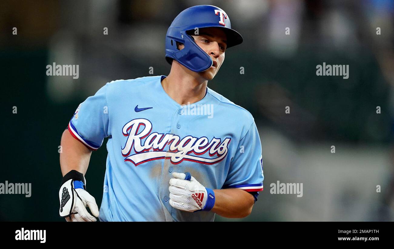 Texas Rangers' Corey Seager rounds the bases after hitting a solo