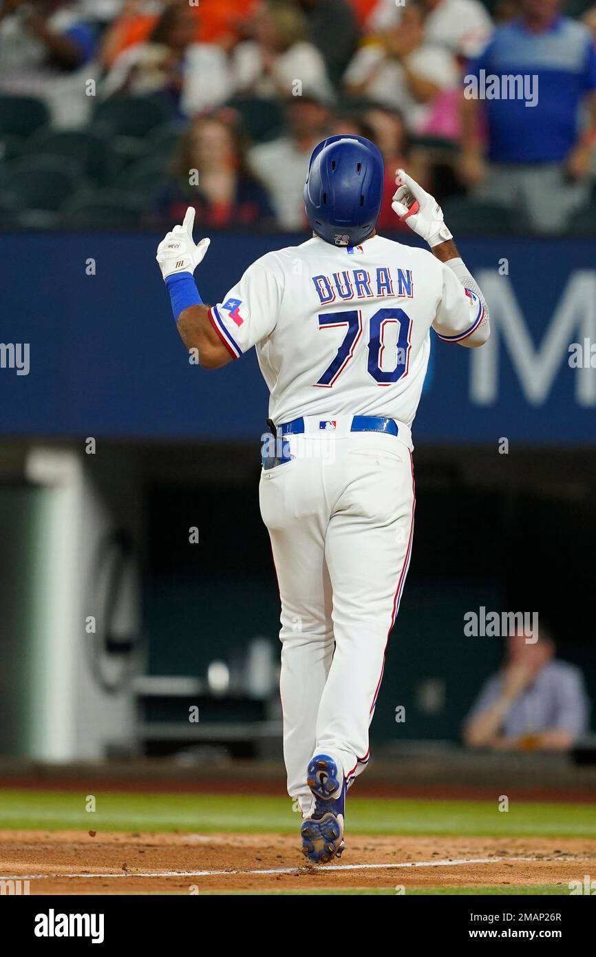 Texas Rangers' Ezequiel Duran celebrates his solo home run as he