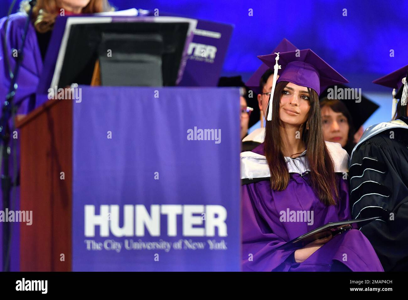 Model and author Emily Ratajkowski waits to deliver the commencement