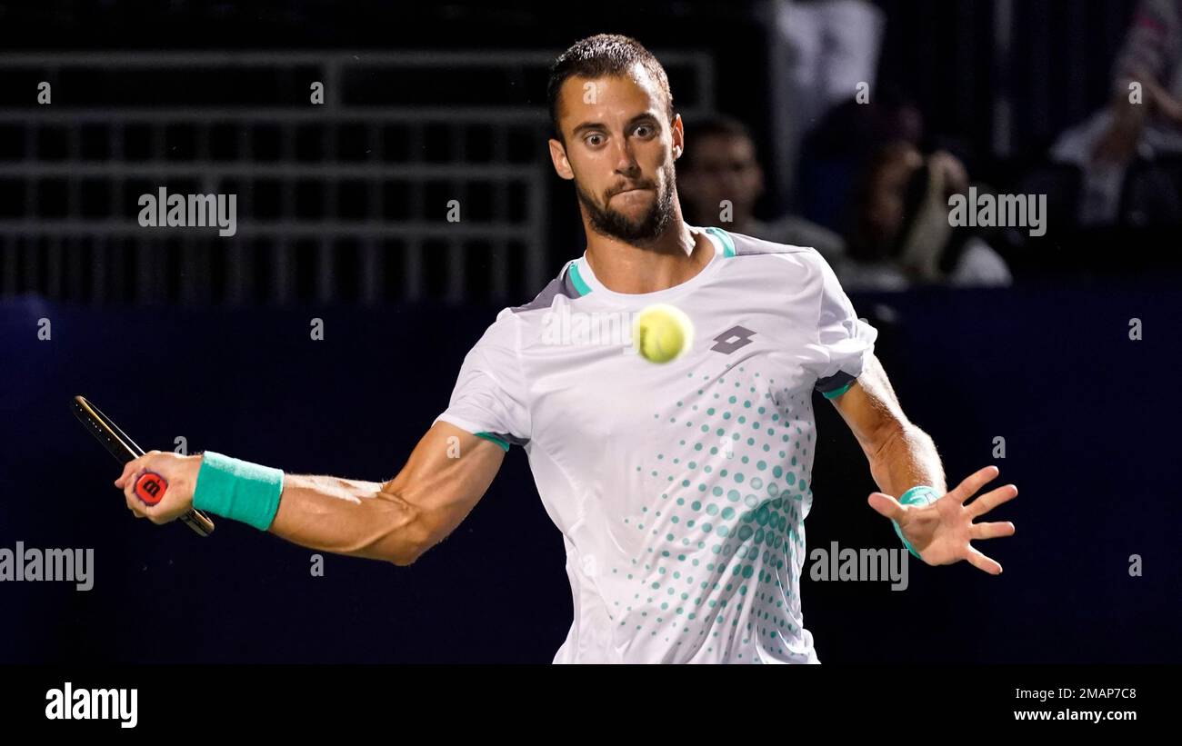 Laslo Djere, of Serbia, returns a shot against Marc-Andrea Huesler, of Switzerland, during their semifinal match in the Winston-Salem Open tennis tournament in Winston-Salem, N.C., Saturday, Aug
