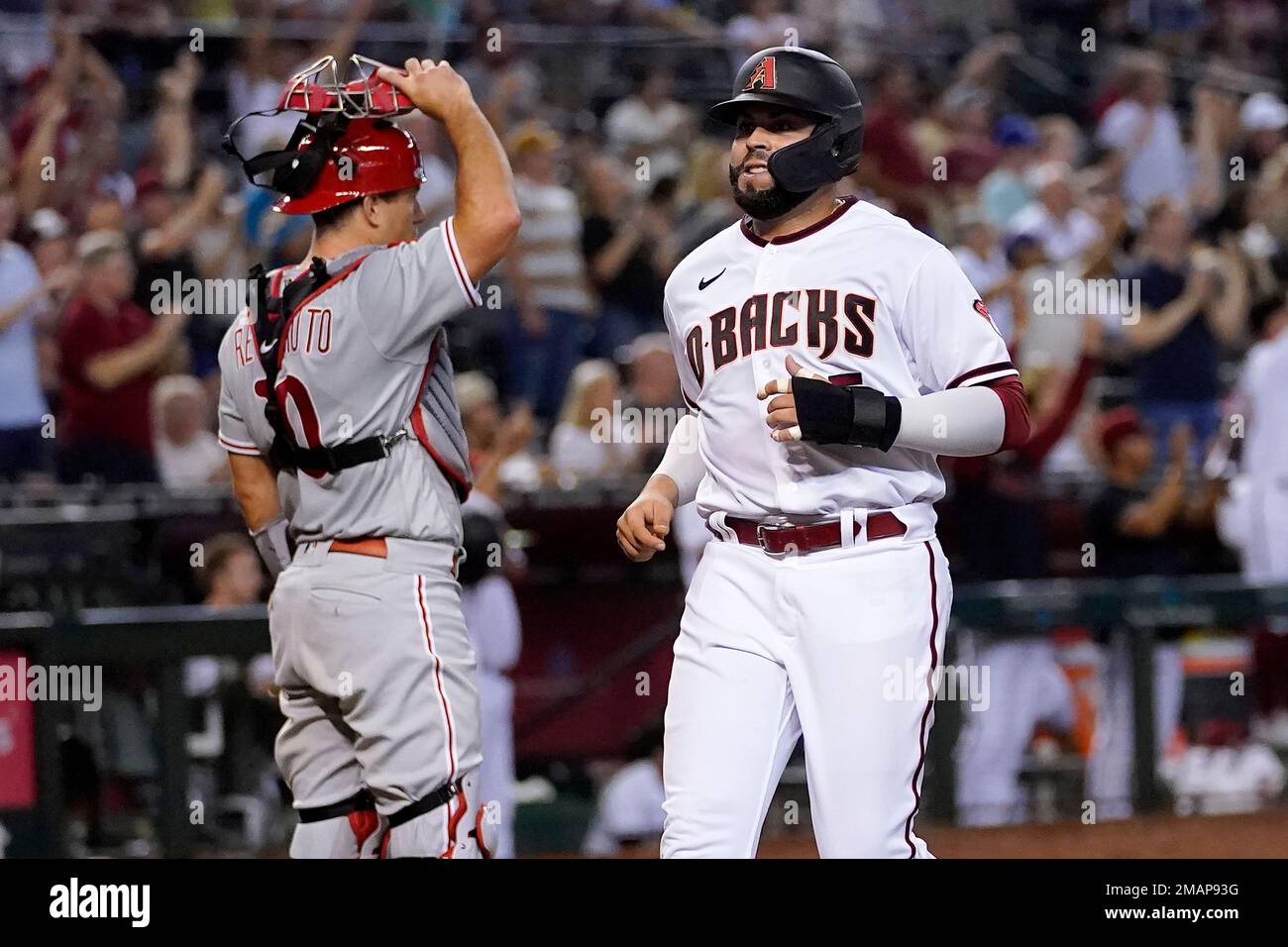 Arizona Diamondbacks' Emmanuel Rivera scores on a double hit by Corbin ...