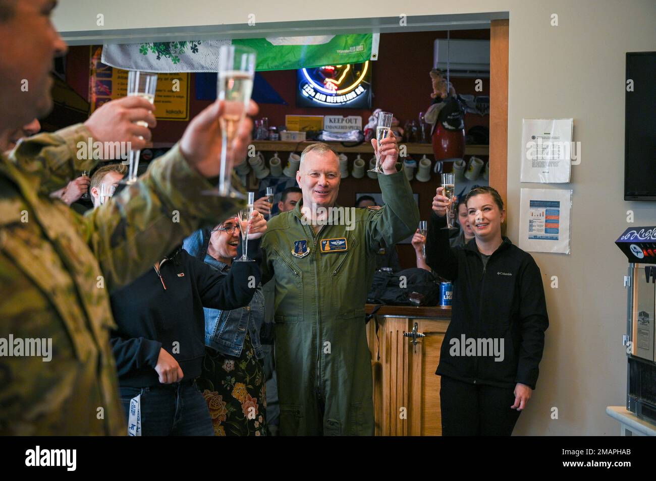 157th Air Refueling Wing Commander, Col. John Pogorek, celebrates with family and wingmen after