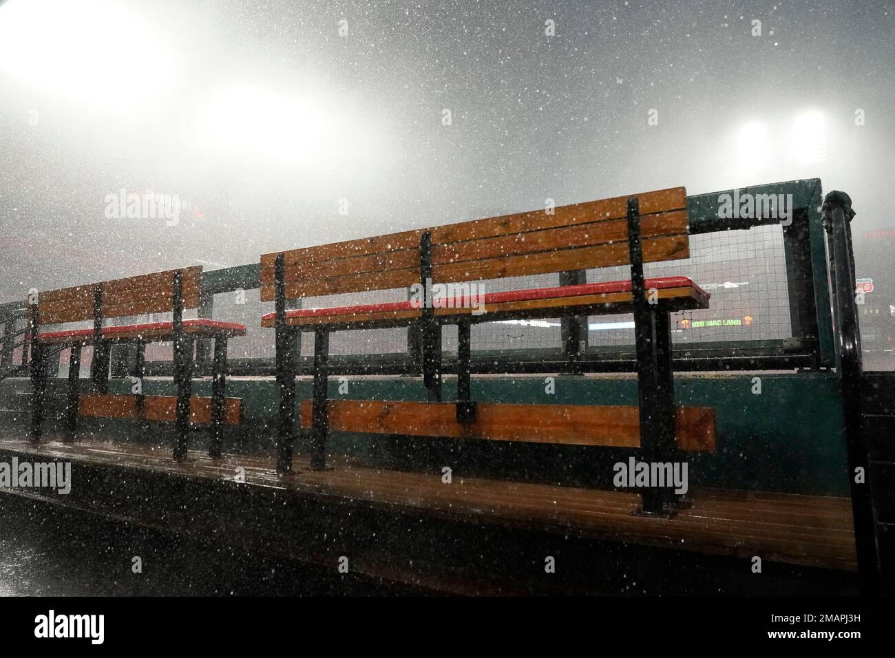 Dugout Raining Benches in the St. Louis Cardinals dugout are empty as heavy rain falls ...