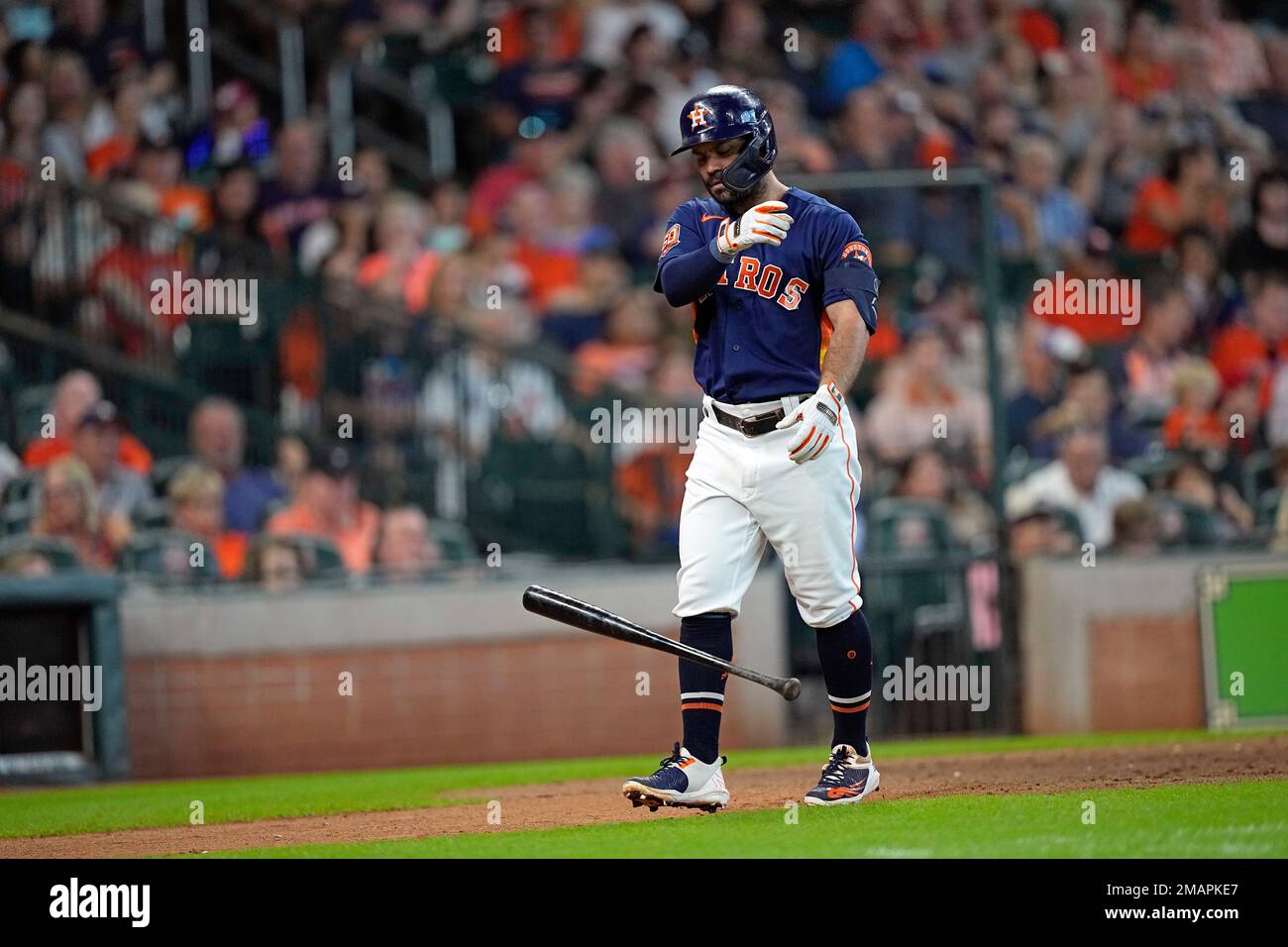 Houston Astros' Jose Altuve tosses his bat after called out on