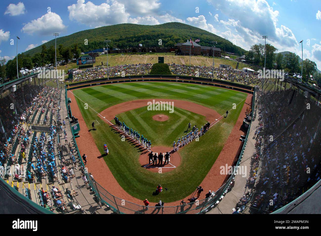 The players of Curacao line the third baseline as the players from
