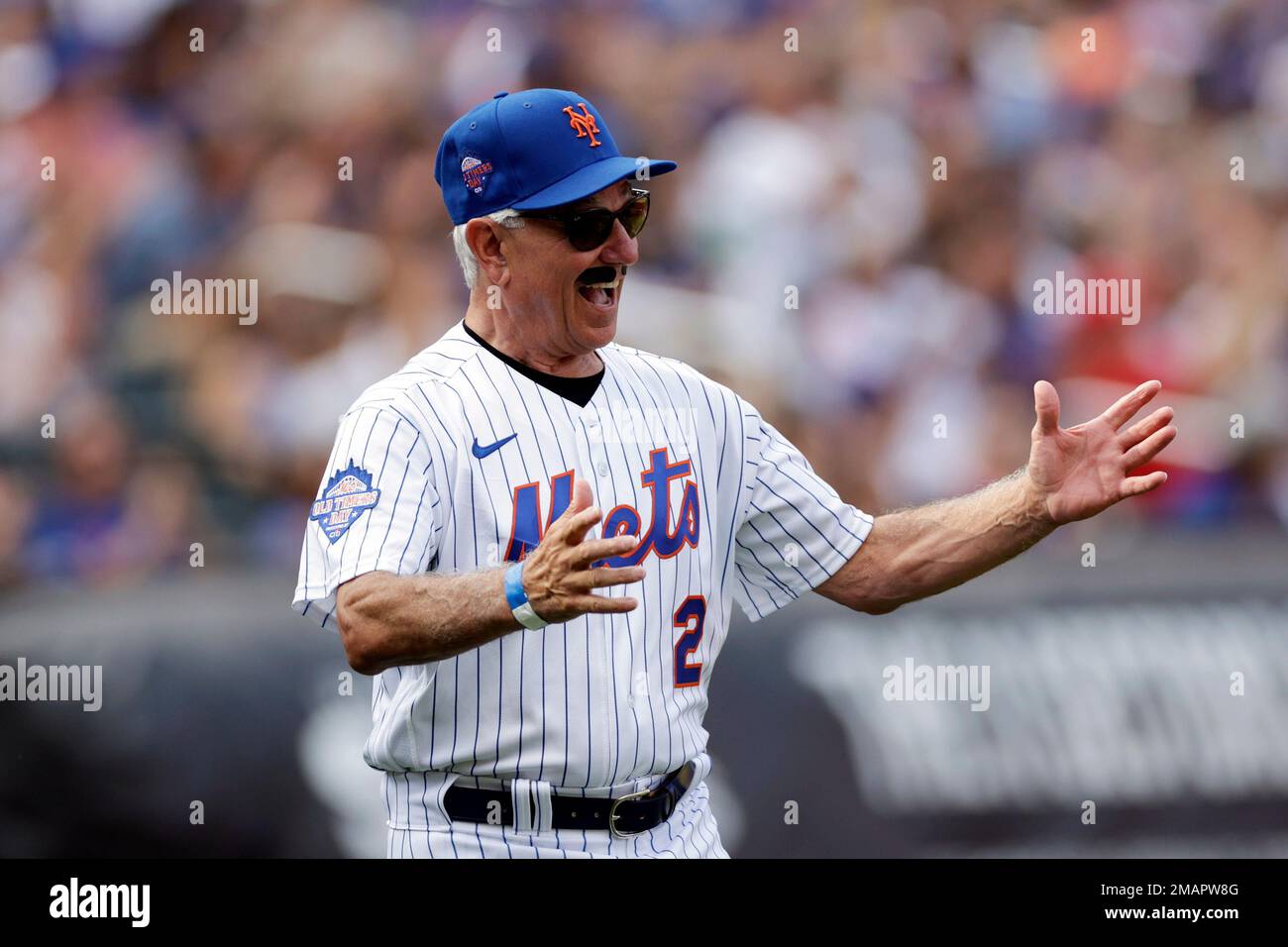 Former New York Mets manager Bobby Valentine waves as he is introduced  during an Old-Timers' Day ceremony before a baseball game between the  Colorado Rockies and the New York Mets on Saturday