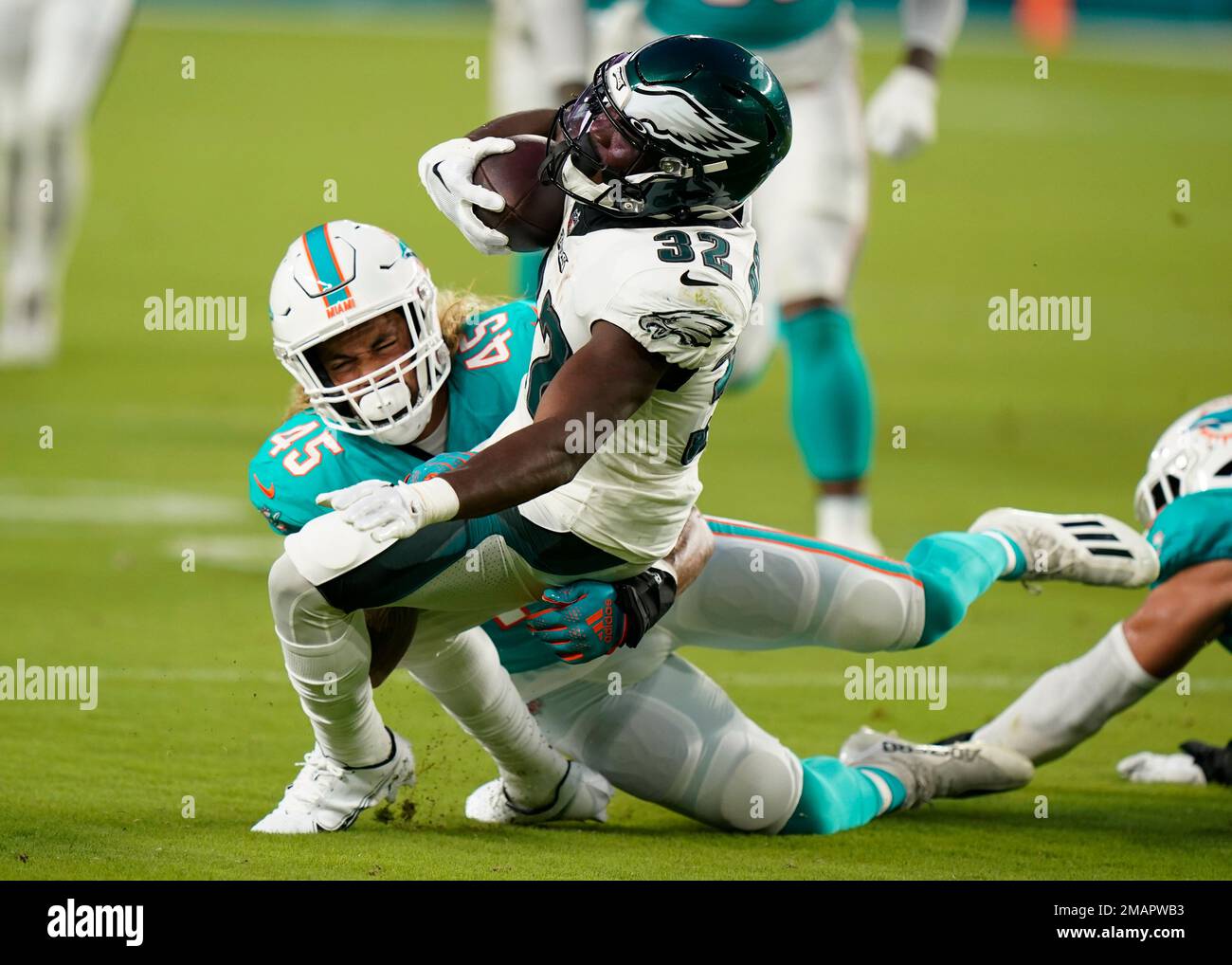 Philadelphia Eagles running back Jason Huntley (32) is tackled by Miami  Dolphins linebacker Duke Riley (45) during the first half of a NFL  preseason football game, Saturday, Aug. 27, 2022, in Miami