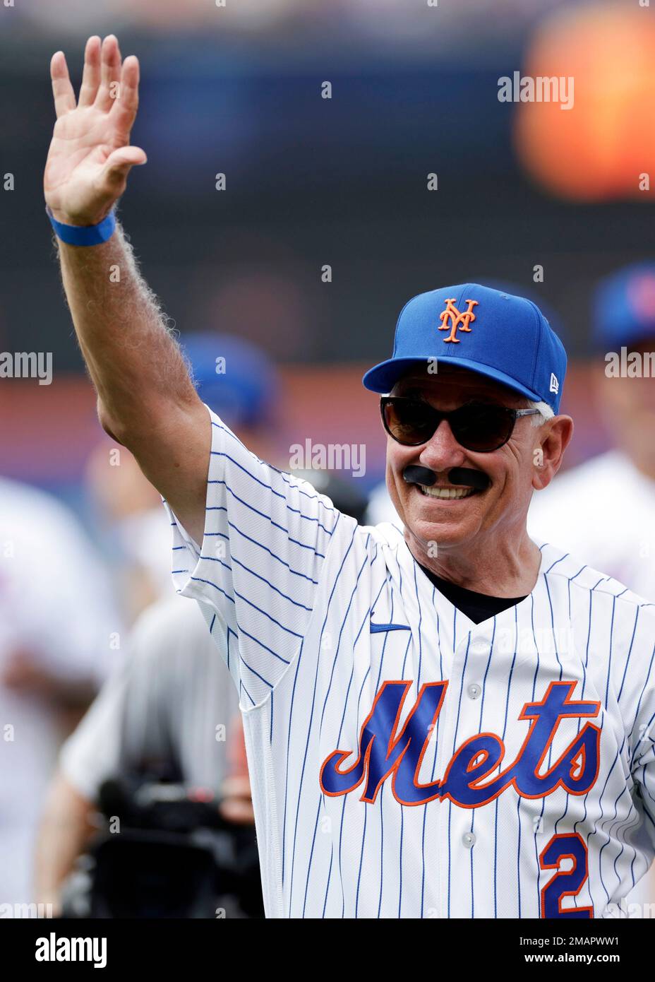 Former New York Mets manager Bobby Valentine waves as he is introduced  during an Old-Timers' Day ceremony before a baseball game between the  Colorado Rockies and the New York Mets on Saturday