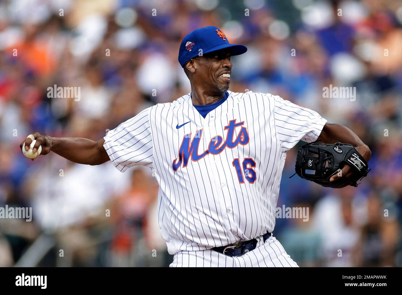 Former New York Mets pitcher Dwight Gooden throws during an Old-Timers'  game before a baseball game between the Colorado Rockies and the New York  Mets on Saturday, Aug. 27, 2022, in New