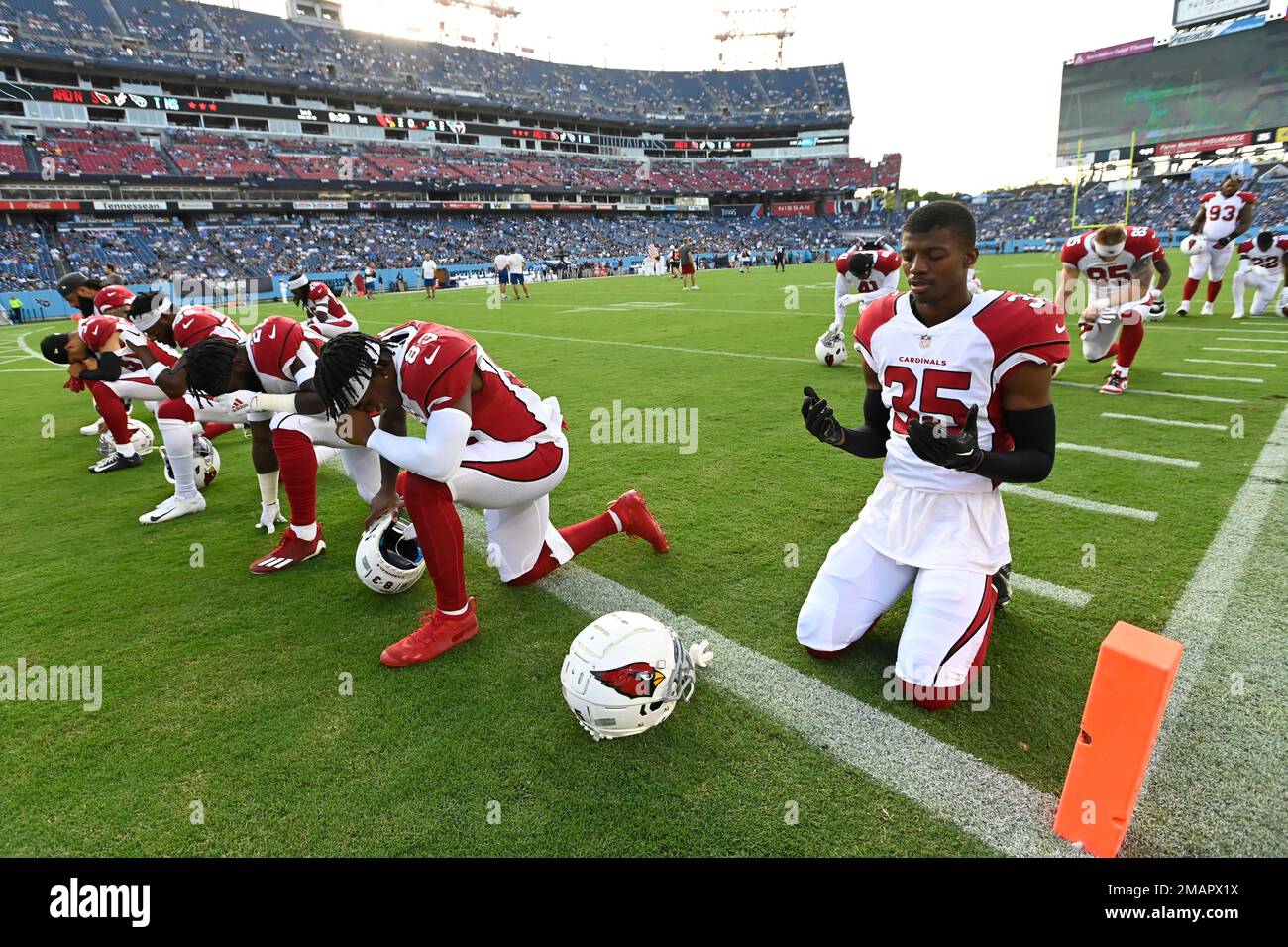 Arizona Cardinals cornerback Christian Matthew (35) kneels on the