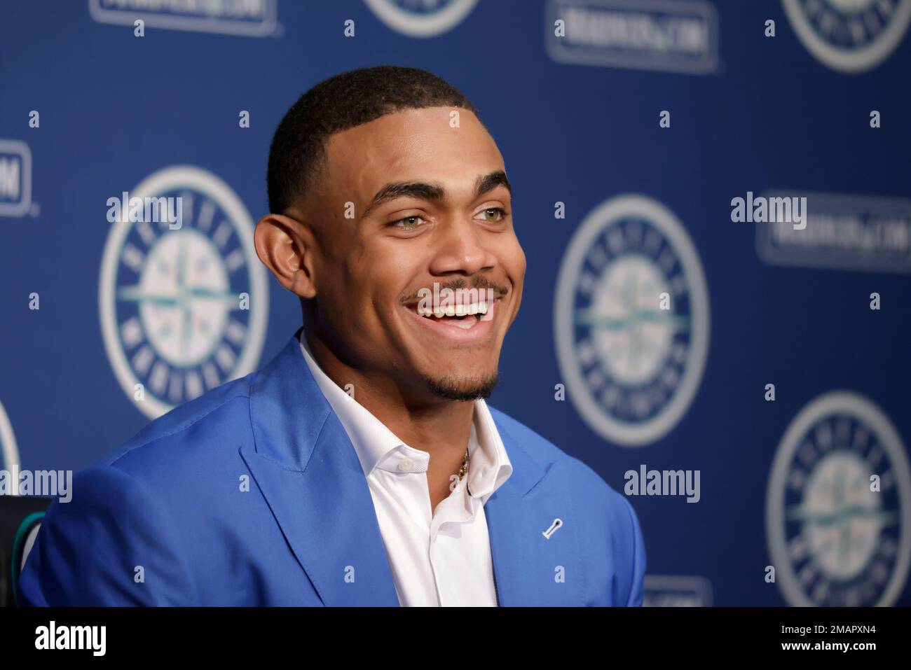 Seattle Mariners' Julio Rodriguez smiles as he answers questions