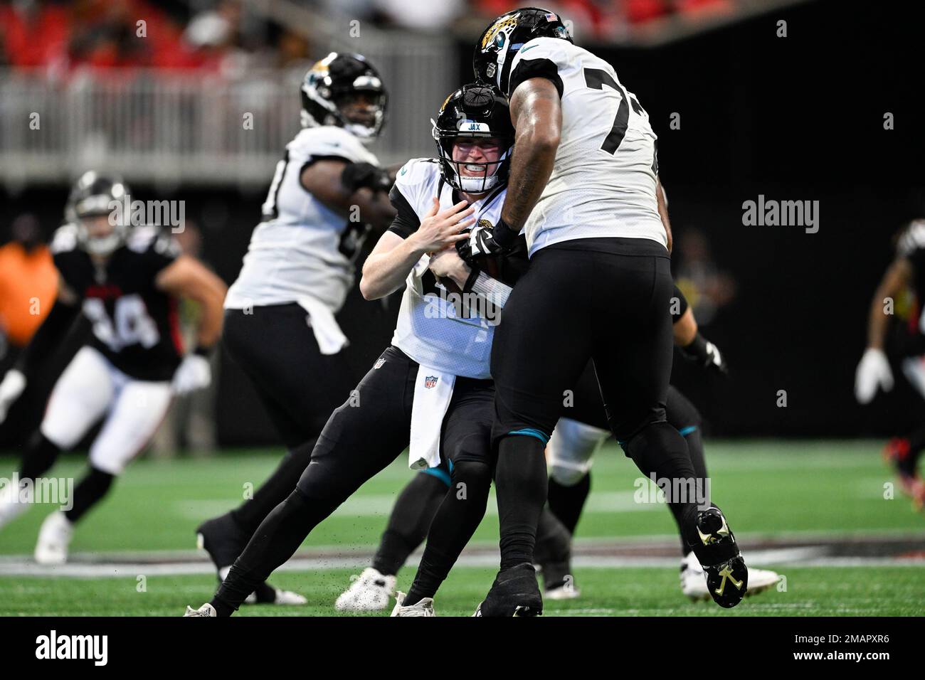 Jacksonville Jaguars center Nick Ford (77) looks at the video screen from  the sidelines during the second half of an NFL preseason football game  against the Cleveland Browns, Friday, Aug. 12, 2022