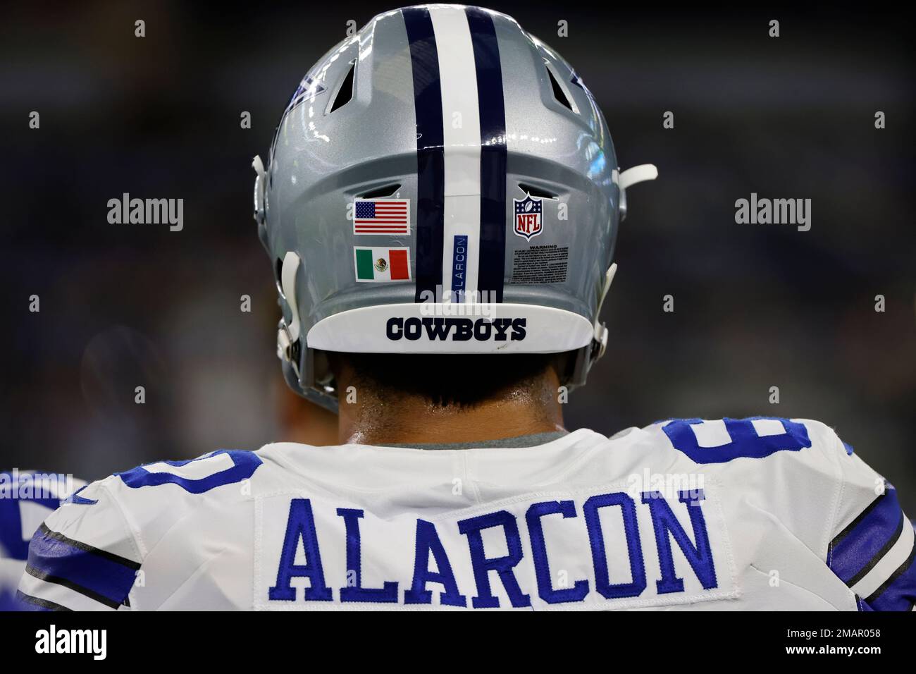 Dallas Cowboys offensive tackle Isaac Alarcon wears the flag of