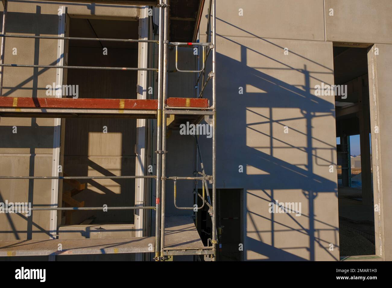 house in scaffolding .walls of the house in scaffolding.Building materials and the process of