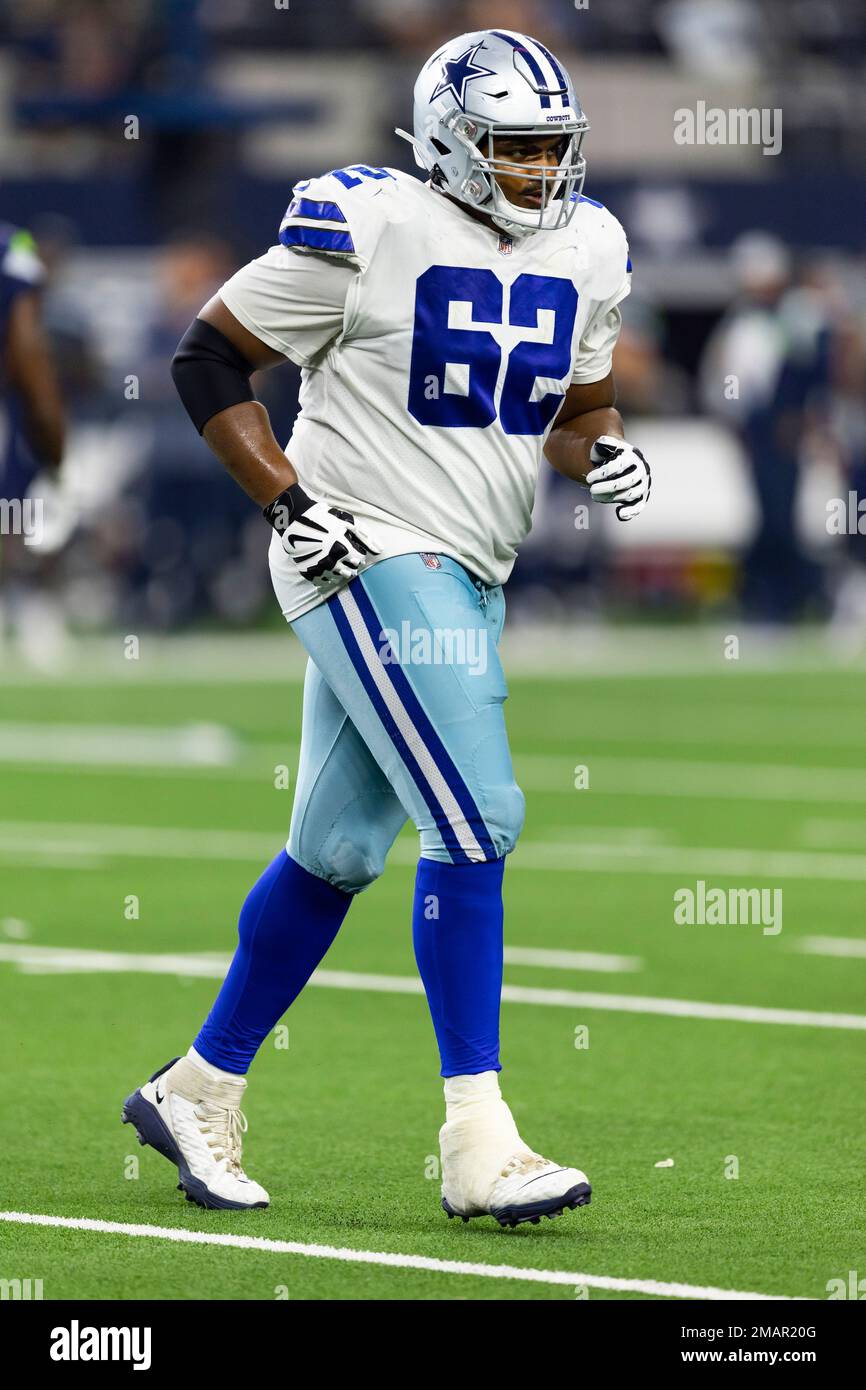 Dallas Cowboys quarterback Ben DiNucci, front left, takes a snap from  center Braylon Jones at practice at the NFL football team's training camp  in Oxnard, Calif., Wednesday, July 28, 2021. (AP Photo/Michael