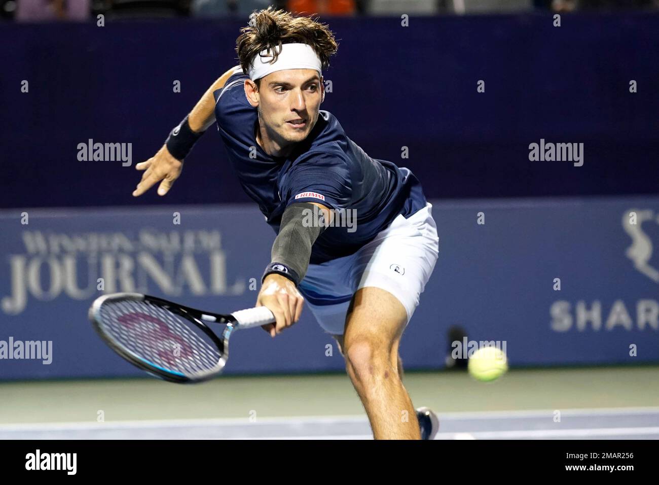 Marc-Andrea Huesler, of Switzerland, returns a shot against Laslo Djere, of Serbia, during their semifinal match in the Winston-Salem Open tennis tournament in Winston-Salem, N.C., Friday, Aug