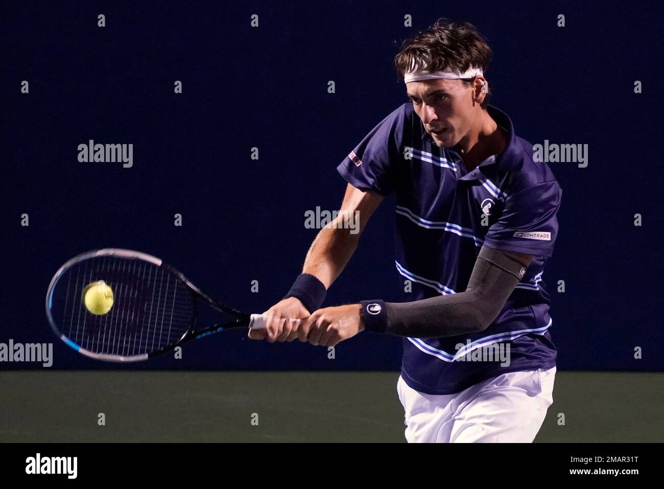 Marc-Andrea Huesler, of Switzerland, returns shot against Laslo Djere, of Serbia, during their semifinal match in the Winston-Salem Open tennis tournament in Winston-Salem, N.C., Friday, Aug
