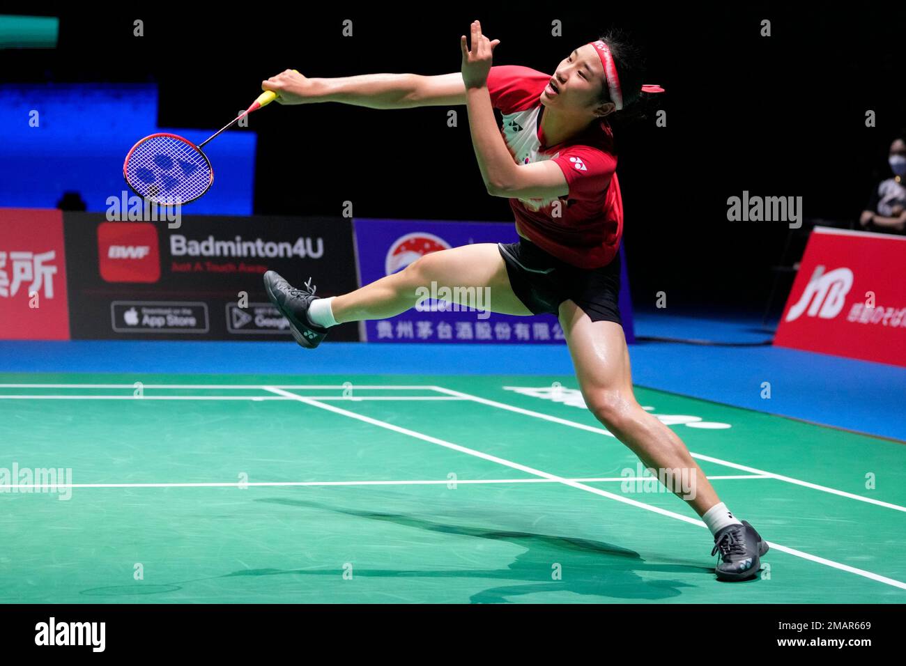 An Se-young of South Korea plays a shot during a badminton game of the  women's singles quarterfinal against Han Yue of China in the BWF World  Championships in Tokyo, Friday, Aug. 26,