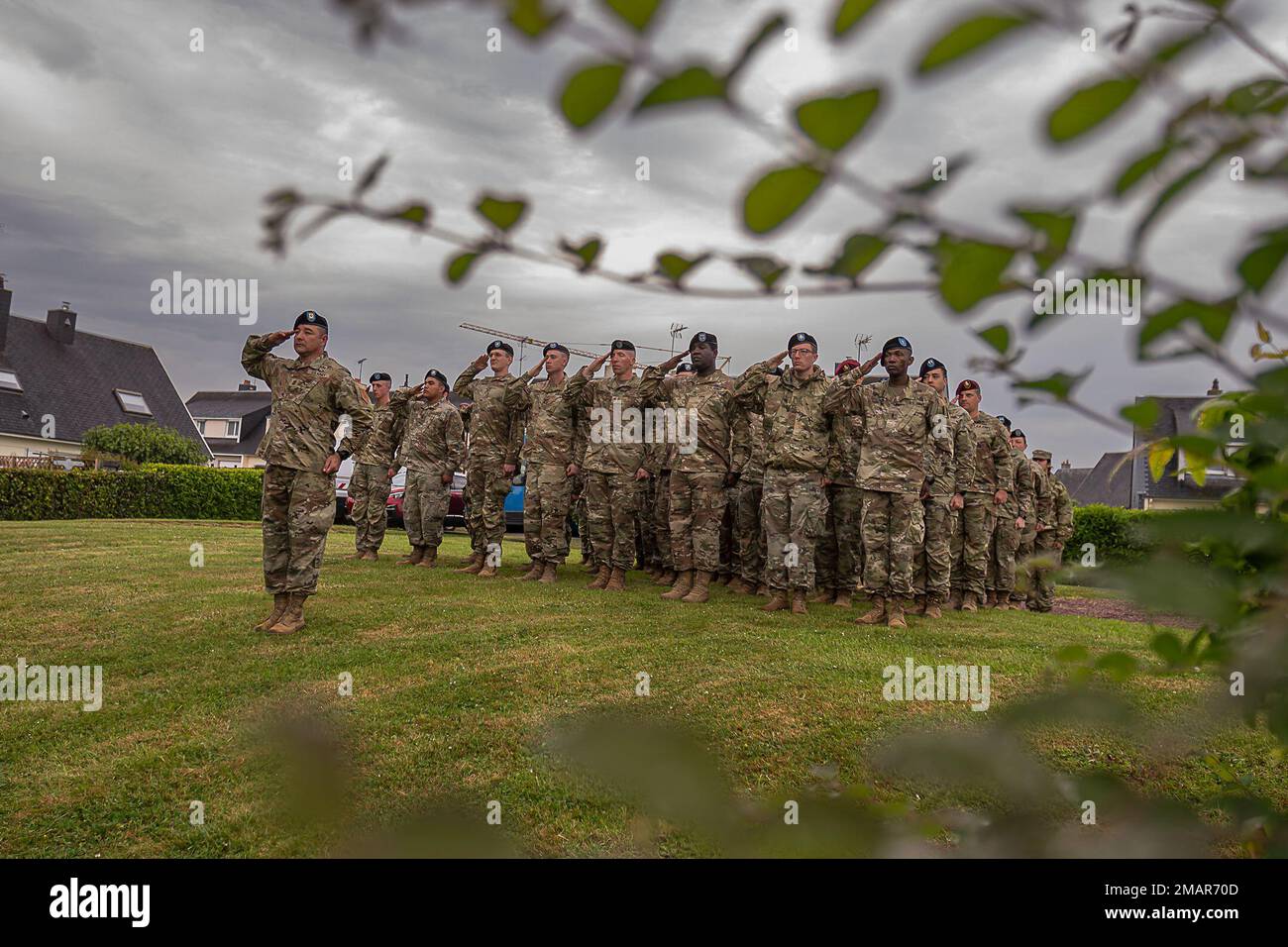 U.S. Army Soldiers render a salute, June 3, 2022, during the D-Day 78th Anniversary Events, at Montebourg, Normandie, France. Soldiers rendered salute to National Anthems of the United Kingdom, Germany, United States of America and France.Together, the US and our indispensable European allies are demonstrating the strength of alliance and dedicated resolve borne out of D-Day 78 years ago and forged over almost eight decades of combat-credible cooperative security. Stock Photo