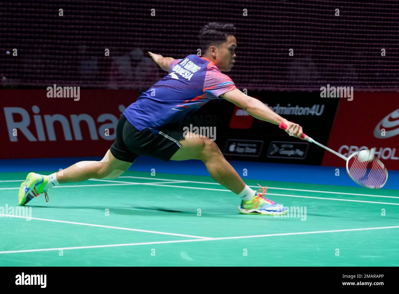 Anthony Sinisuka Ginting of Indonesia plays a return during a badminton game of the mens singles against Shi Yu Qi of China in the BWF World Championships in Tokyo, Thursday, Aug