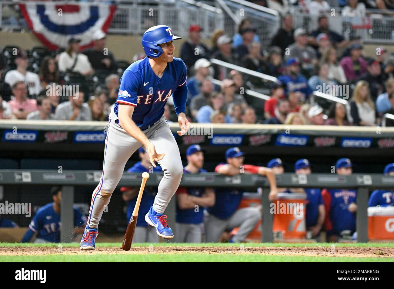 Texas Rangers designated hitter Brad Miller hits a line drive into a double  play against the Minnesota Twins during the ninth inning of a baseball  game, Friday, August 19, 2022, in Minneapolis.