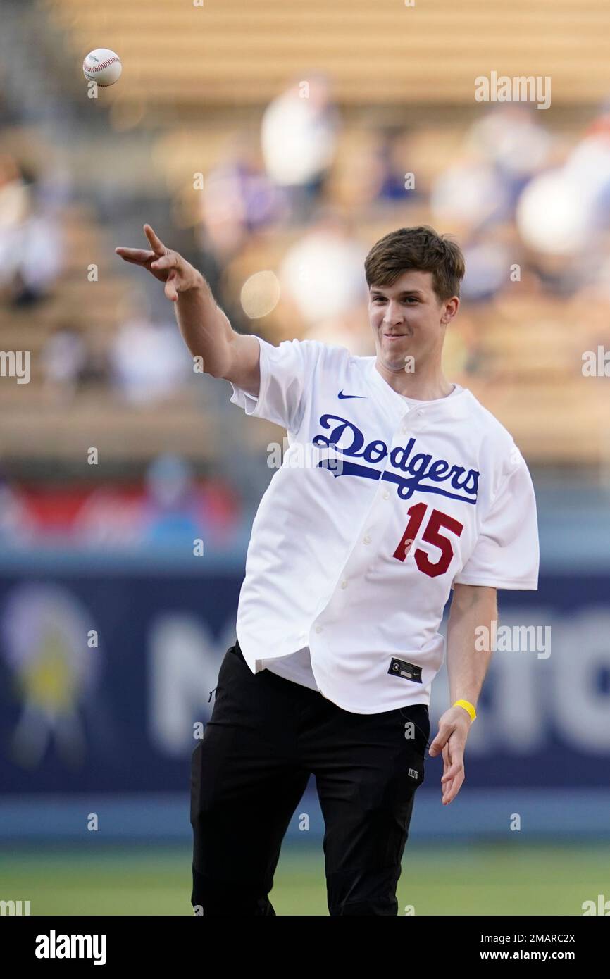 Los Angeles Lakers guard Austin Reaves throws out the first pitch ...