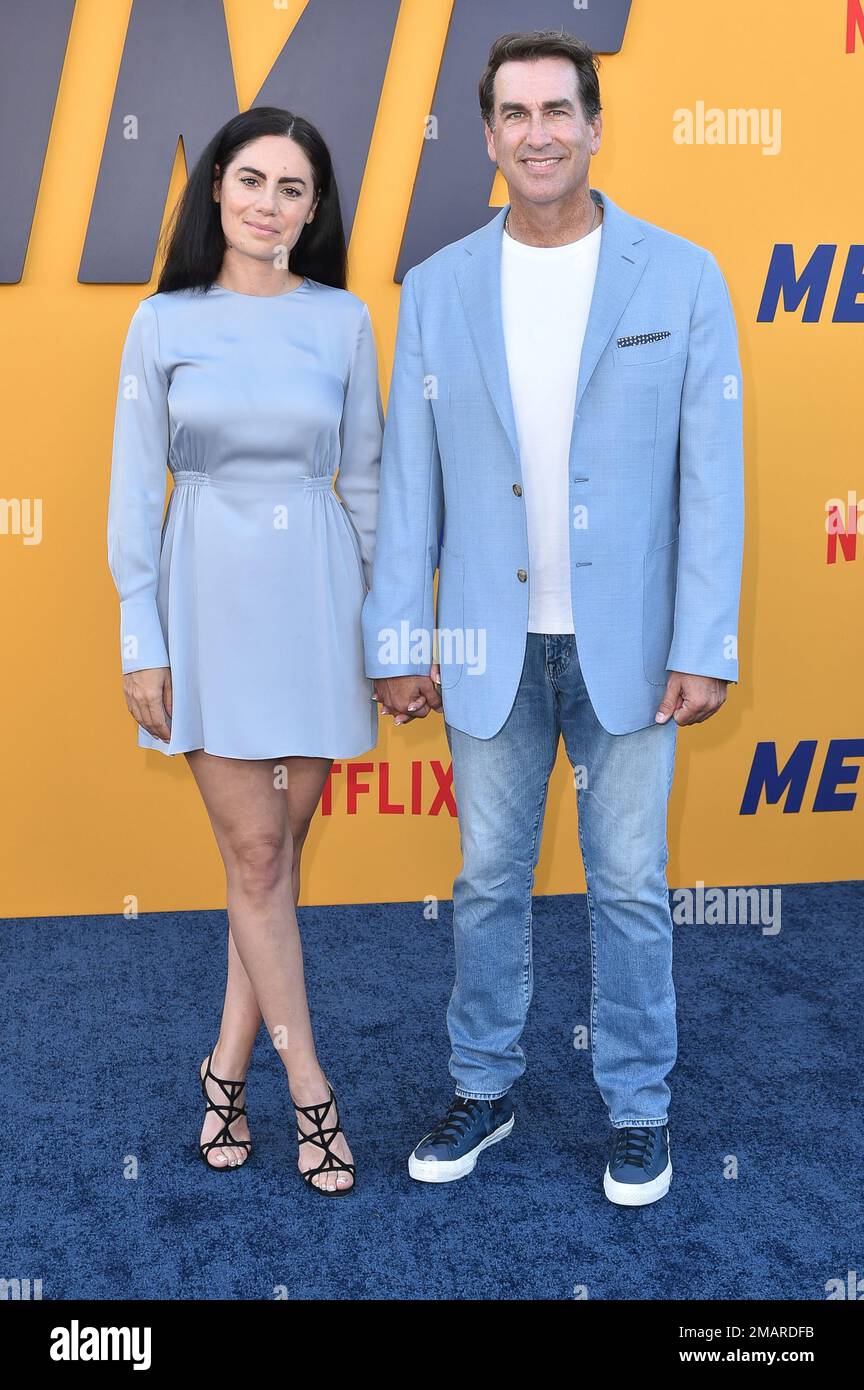 Kasia Kay, Rob Riggle arrive at the premiere of