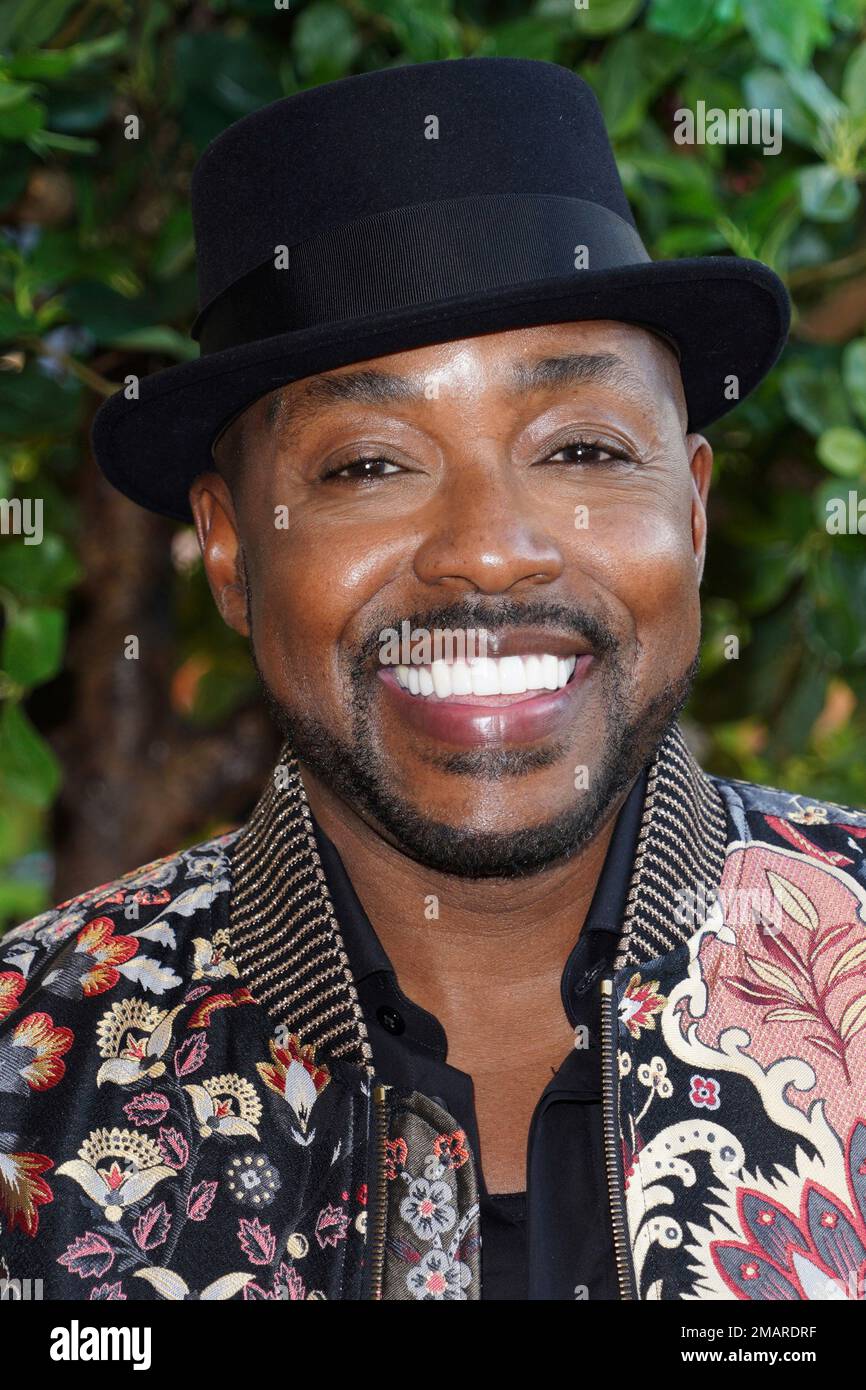 Will Packer poses for photographers upon arrival at the UK special