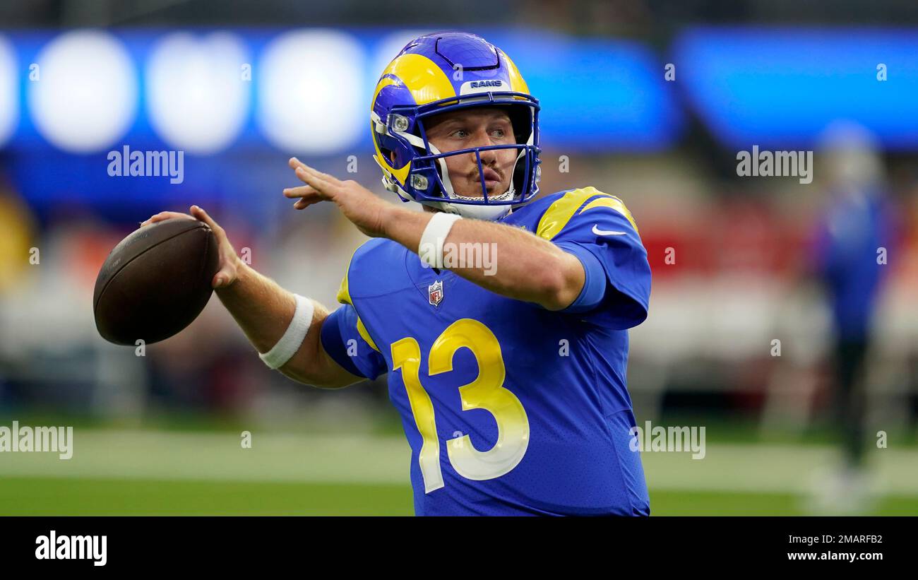 Inglewood, Calif. 13/11/2022, Los Angeles Rams quarterback John Wolford (13)  rolls out of the pocket against the Arizona Cardinals defense during a NFL  football game, Sunday, Nov. 13, 2022, in Inglewood, Calif.
