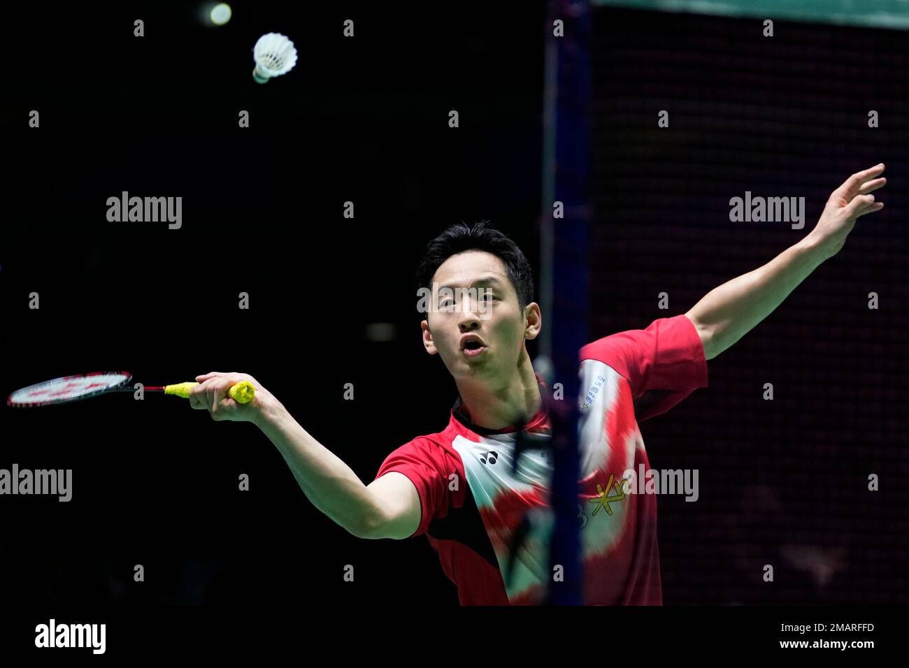 Choi Sol-gyu of South Korea, with Shin Seung-chan, plays a return during a badminton game of the mixed doubles against Dechapol Puavaranukroh and Sapsiree Taerattanachai of Thailand in the BWF World Championships