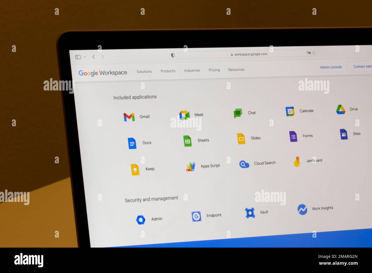 Webpage of Google Workspace, showing icons of included applications, are seen on the Google website on a MacBook computer. Stock Photo