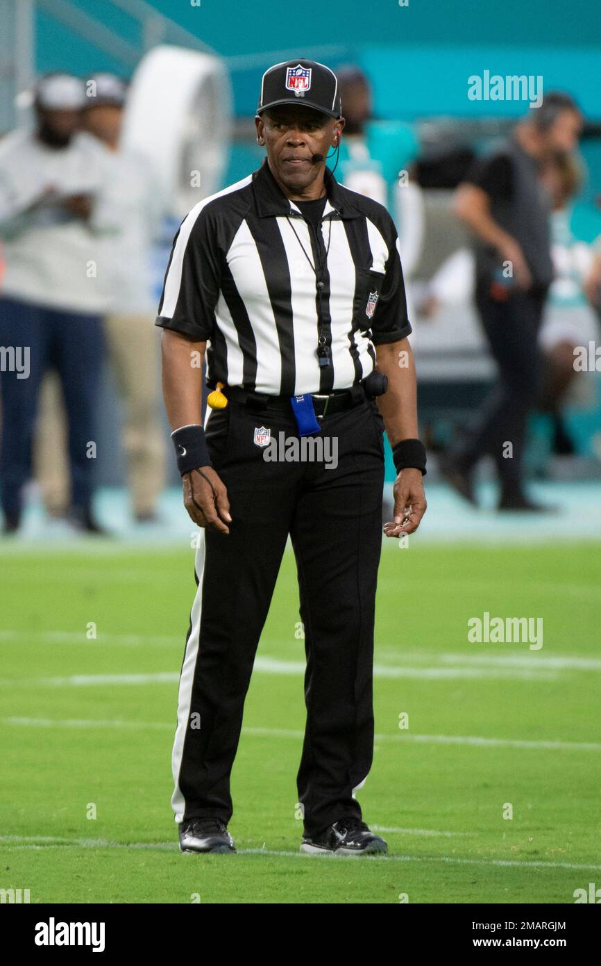 NFL Line Judge Carl Johnson stands on the field during an NFL football