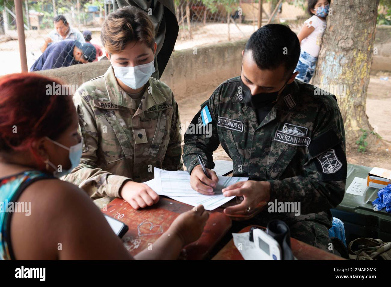 A U.S. Army soldier works side by side with a Honduran Navy captain during a global health engagement at Las Mesas, department of Comayagua, June 3, 2022. As part of the U.S. Southern Command’s enduring partnership to Central America, Joint Task Force-Bravo executed a three-day Global Health Engagement in Comayagua, Honduras, June 1-3, working side by side with local military and Ministry of Health personnel. Stock Photo