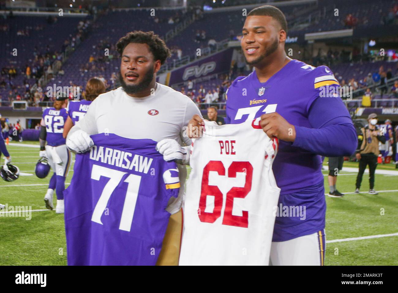 San Francisco 49ers center Jason Poe, left, and Minnesota Vikings