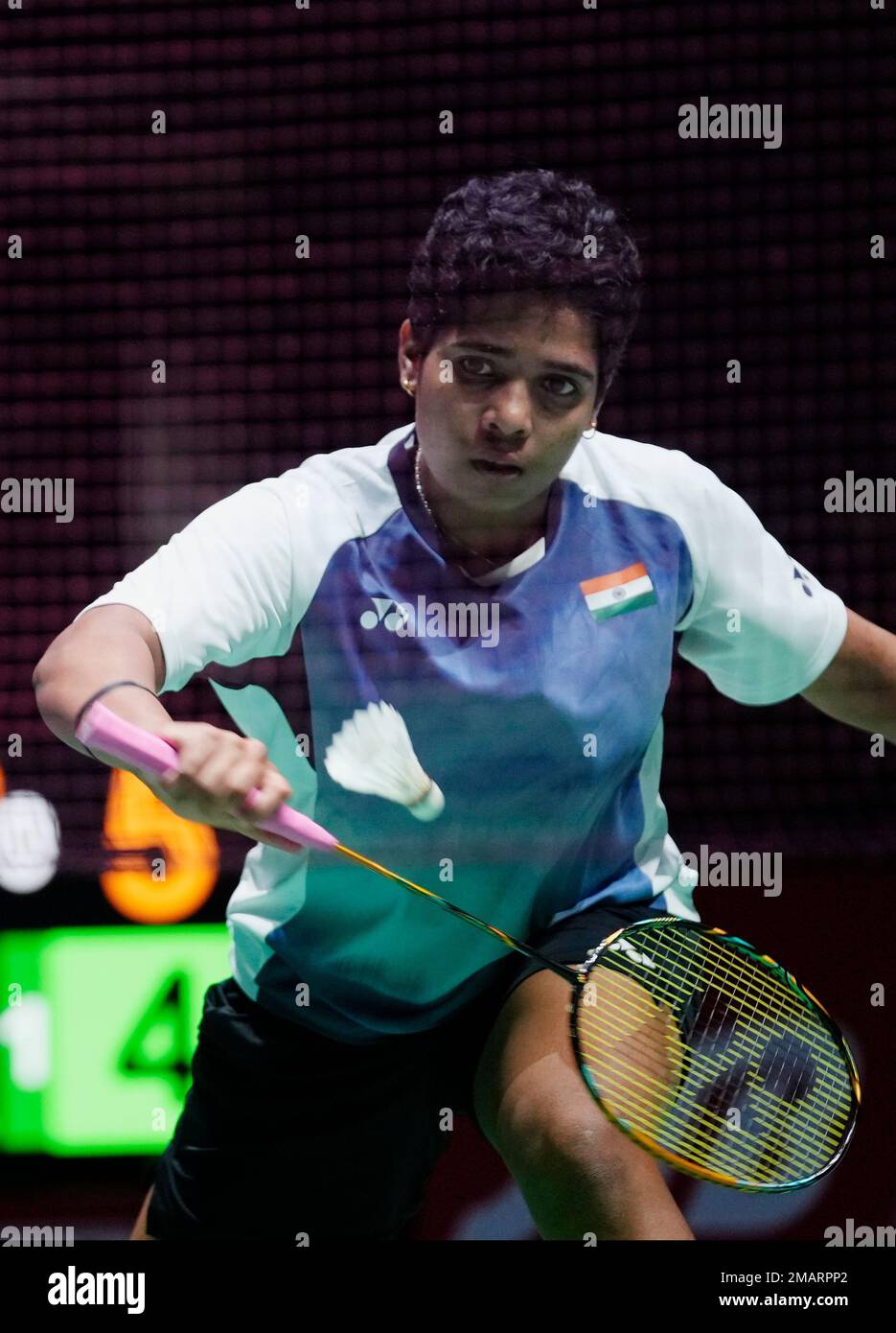 Treesa Jolly of India, with Gayatri Gopichand Pullela, plays a return during a badminton game of the womens doubles against Low Yeen Yuan of Malaysia and Valeree Siow in the BWF World