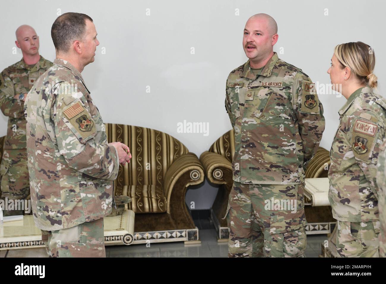 Technical Sgt. Daniel Gisch, a radar technician assigned to the 727th Expeditionary Air Control Squadron, also known as “Kingpin”, meets with Lt. Gen. Gregory M. Guillot, the Ninth Air Force (Air Forces Central) commander June 3, 2022 at Al Dhafra Air Base, United Arab Emirates. Gisch was recognized for discovering a fault in the radar system, which resulted in saving the U.S. Air Force more than $2 million dollars in parts and repairs. Stock Photo