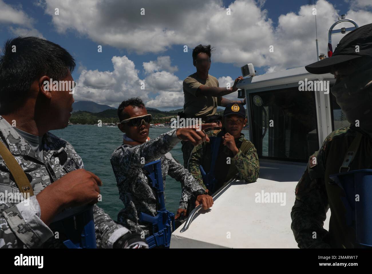 A soldier with 1st Special Forces Group (Airborne) observes as members of the Philippine