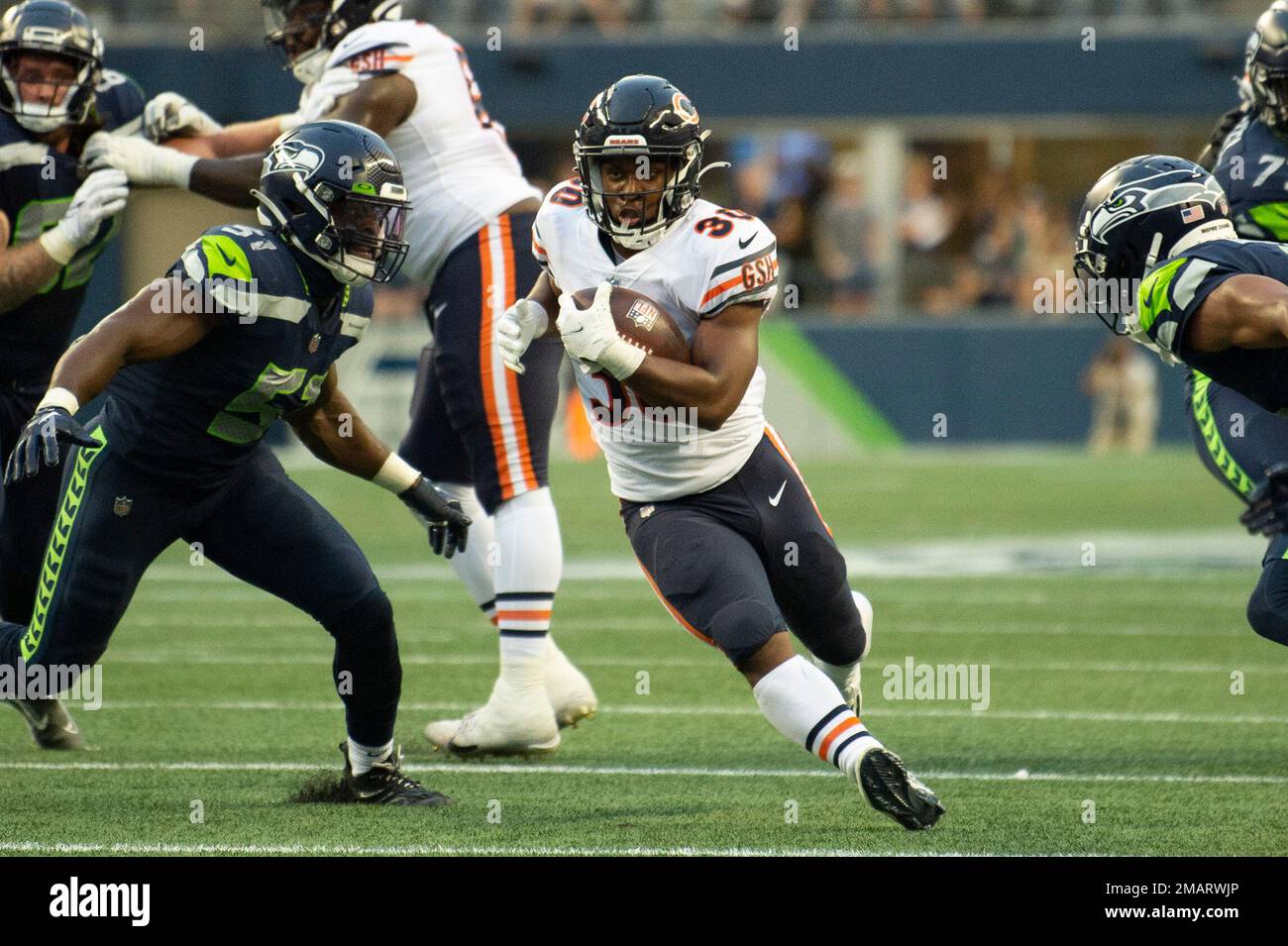 Chicago, United States. 13th Aug, 2022. Chicago Bears running back  De'Montre Tuggle (30) runs the ball against the Kansas City Chiefs during  the fourth quarter of a preseason game at Soldier Field