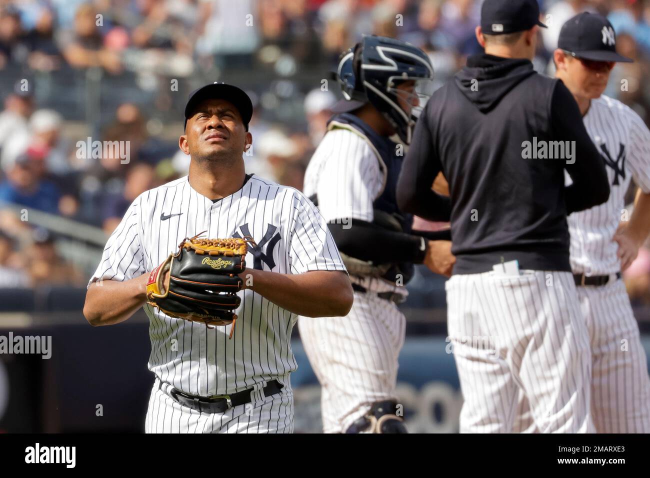 New York Yankees relief pitcher Wandy Peralta walks to the dugout after
