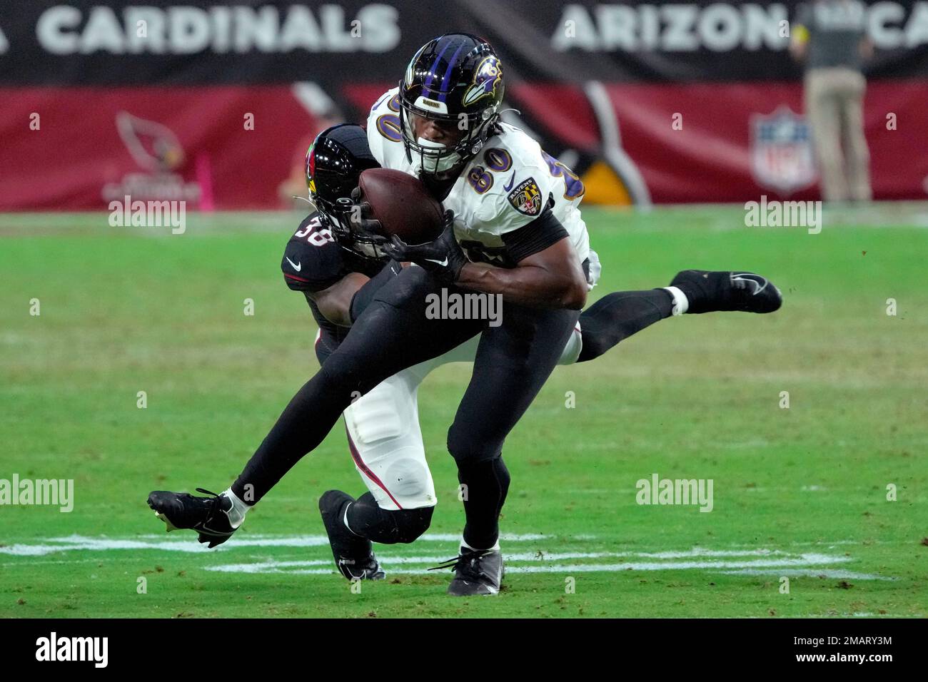 Baltimore Ravens tight end Isaiah Likely (80) makes a catch as Arizona  Cardinals safety James Wiggins (38) defends during the first half of an NFL  preseason football game, Sunday, Aug. 21, 2022,