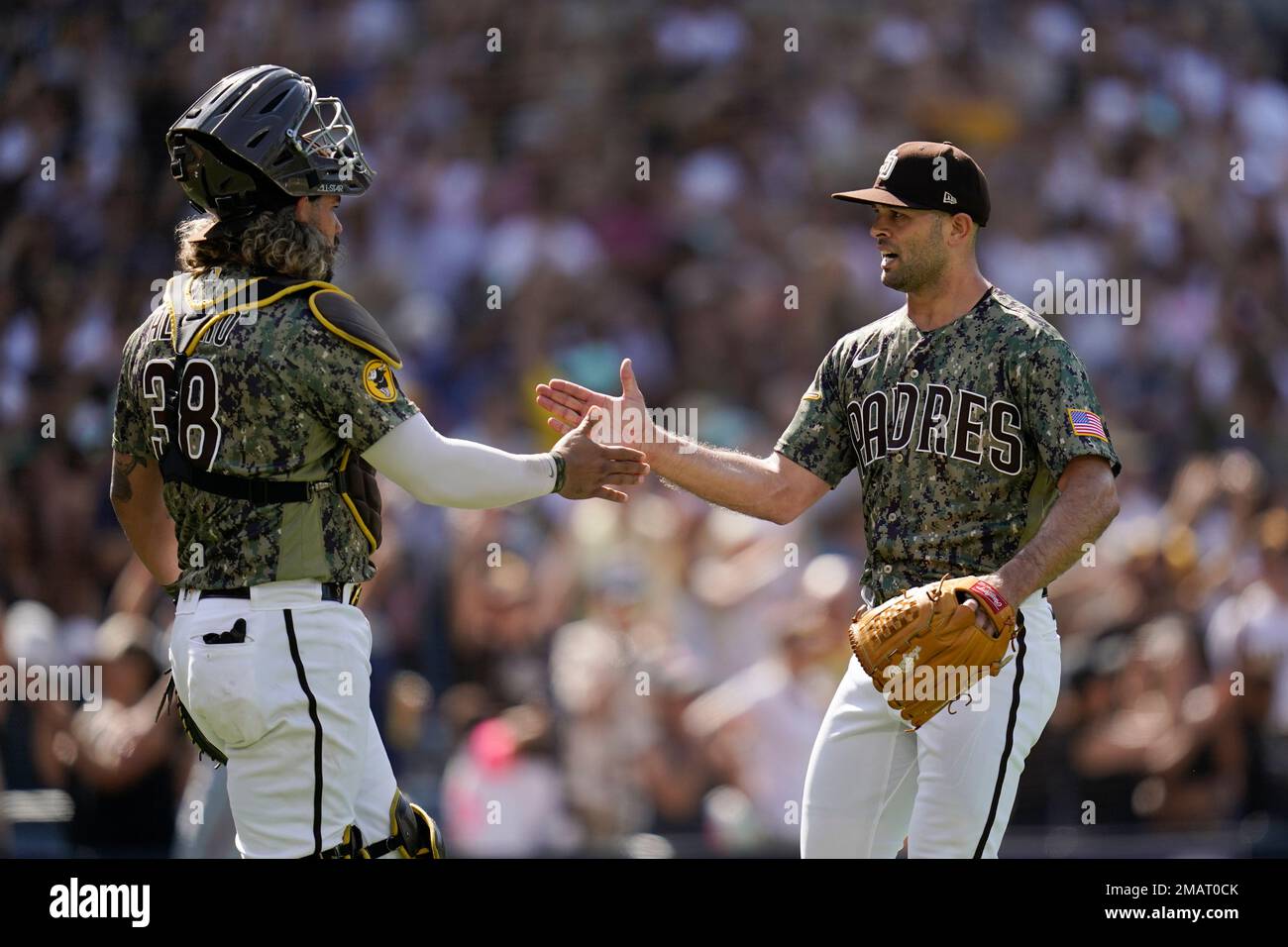 San Diego Padres relief pitcher Nick Martinez, right, celebrates