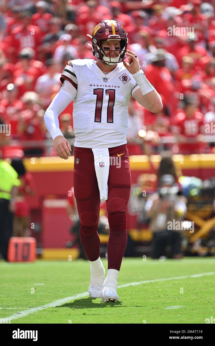 Washington Commanders quarterback Carson Wentz (11) looks to the