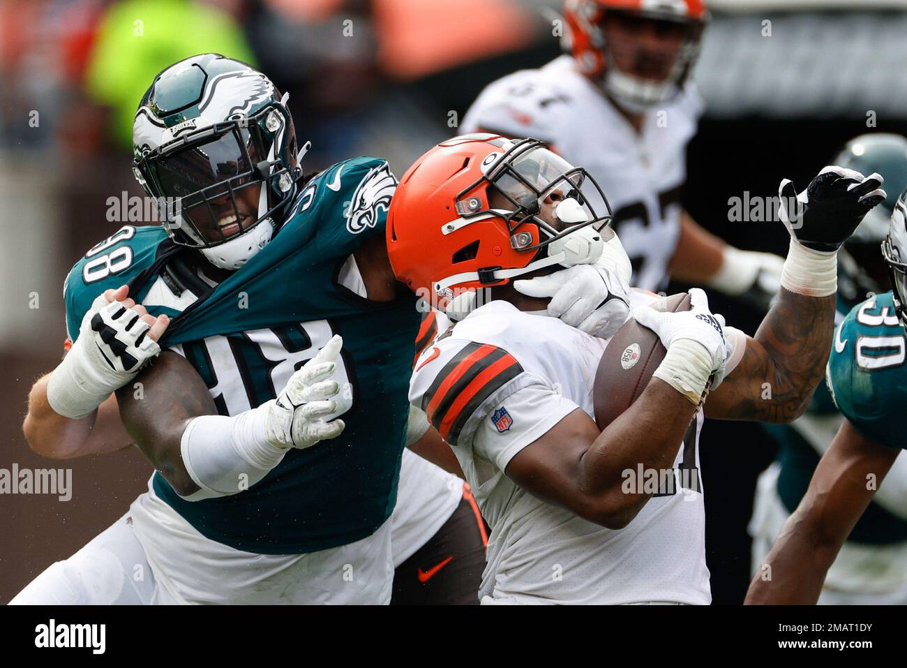 Philadelphia Eagles defensive tackle Renell Wren (98) corrals Cleveland  Browns running back John Kelly Jr., front right, on a run during the second  half of an NFL preseason football game in Cleveland,