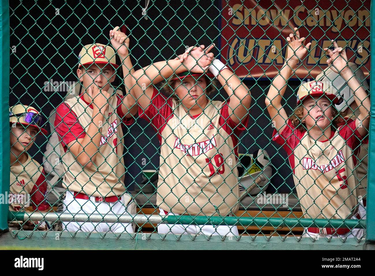 Santa Clara, Utah, players watch from the dugout during the fifth inning of a baseball game against Davenport, Iowa, at the Little League World Series in South Williamsport, Pa., Sunday, Aug