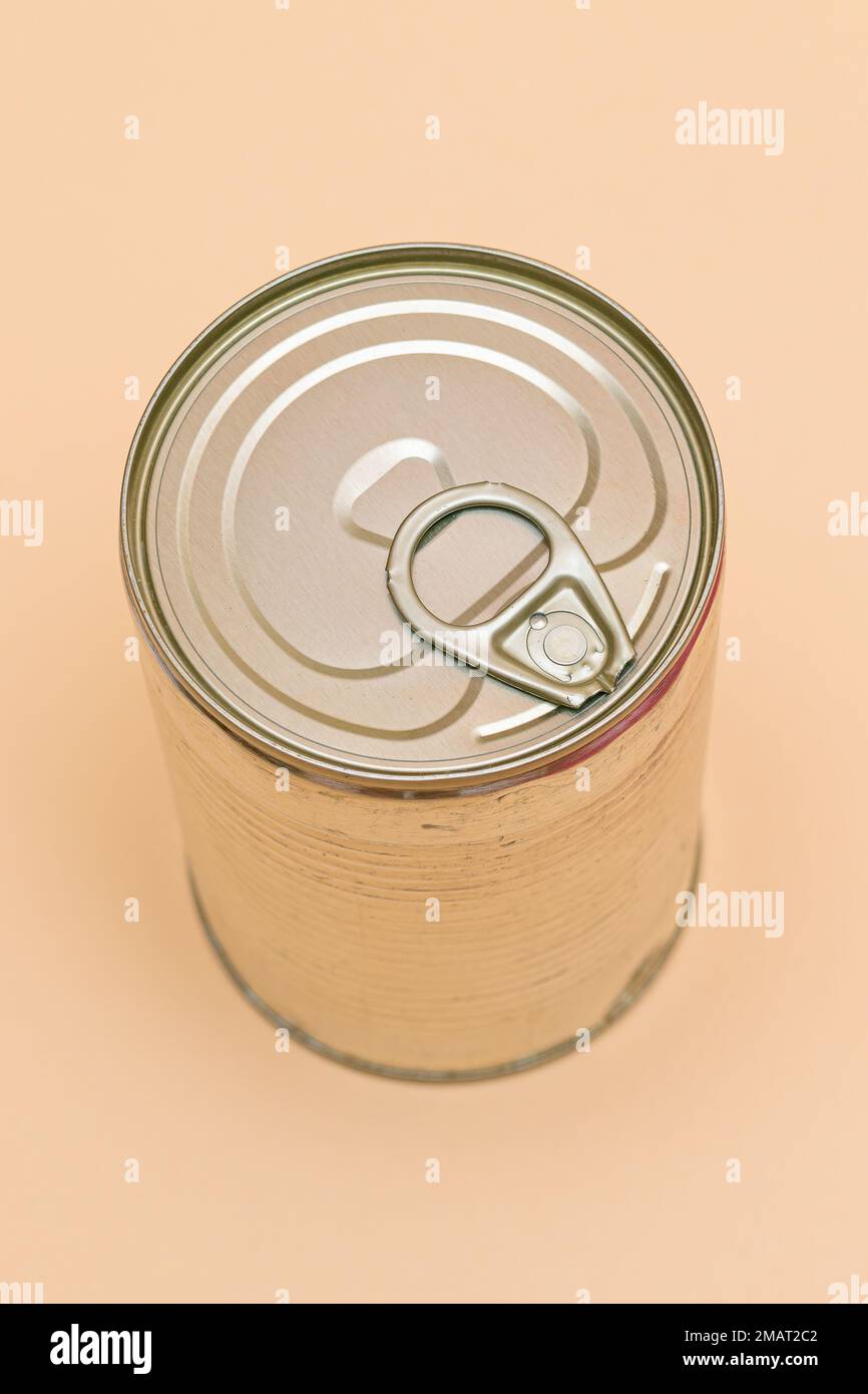 Unopened Tin Can with Blank Edge on Beige Background. Canned Food